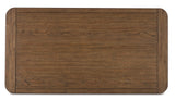Cabalynn coffee table styled with decor in a contemporary space