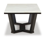 Selena coffee table styled with decor in a contemporary space