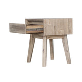 Gia 1 drawer nightstand placed beside a modern bed in bedroom setup