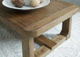 Cabalynn coffee table styled with decor in a contemporary space