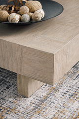 Miller coffee table styled with decor in a contemporary space