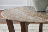 Asmara cocktail table styled with decor in a contemporary living space