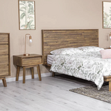 Gia 1 drawer nightstand placed beside a modern bed in bedroom setup