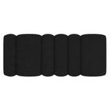 Regal large black bouclé ottoman in modern living room setting