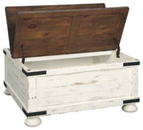 Wystfield cocktail table with storage compartments open displaying interior space